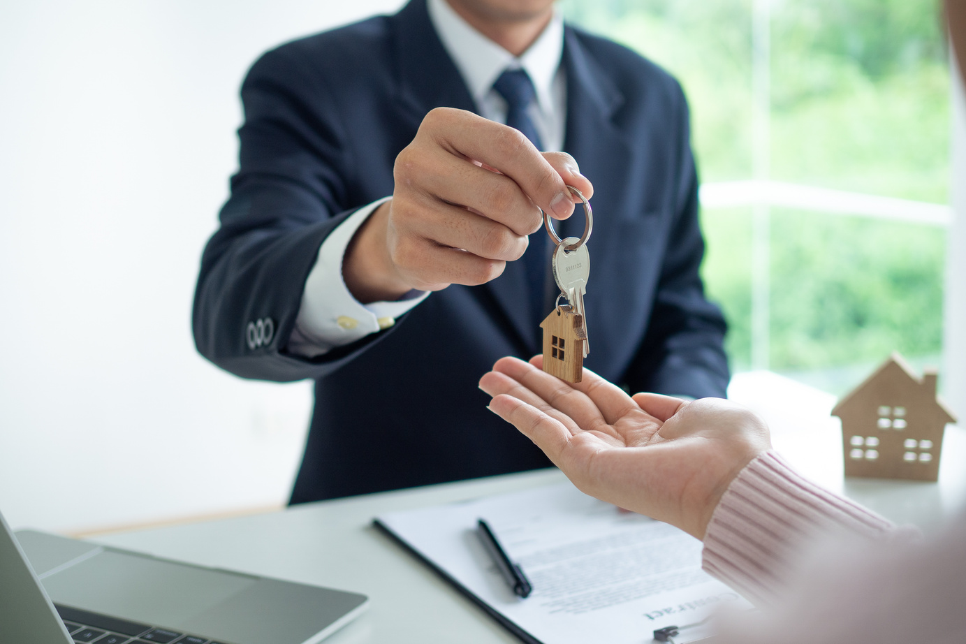 Agent Handing over House Keys